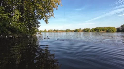 Feeder cage splashing across river surface 4K Stock Footage 316173196