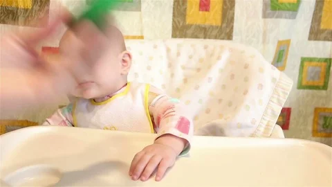 Feeding the baby with a spoon. Stock Footage 72840486