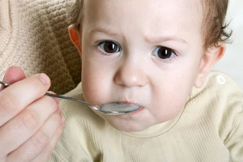 Feeding child Stock Photos