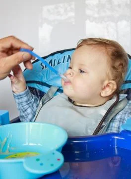 Feeding child Stock Photos