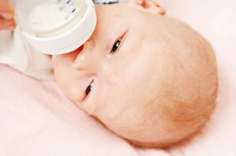Feeding kid Stock Photos