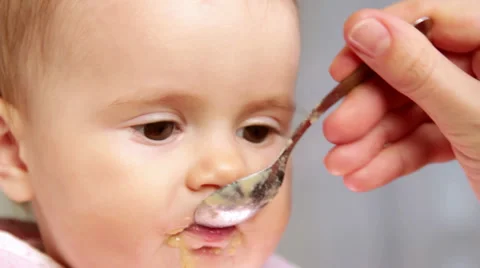 Feeding a small child Stock Footage 32722626