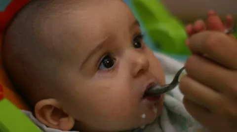 Feeding with a spoon Stock Footage 12587752