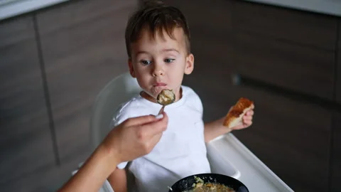 Feeding a toddler from spoon.  Stock Footage 254632712