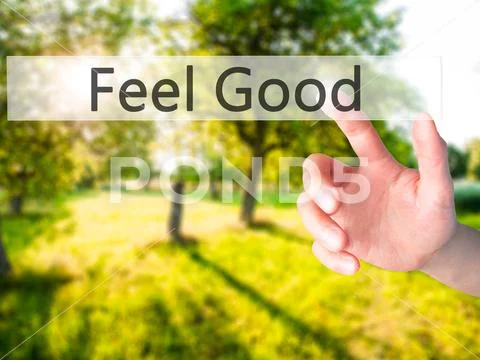 Feel Good - Hand pressing a button on blurred background concept Stock Photos