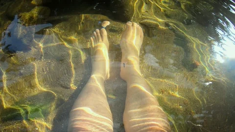 Feel so relax soaking leg in the river on summer vacation 스톡 동영상 125904654