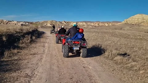 Feel the thrill as a quad ventures through Cappadocia's beauty. Video stock 262888277