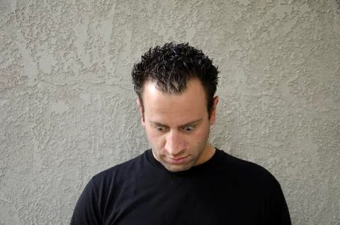 Feeling down? Man looking down. Stock Photos