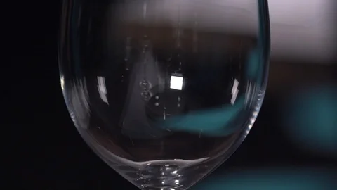 Feeling the glass with wine slowmo Stock Footage 89232073