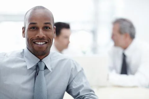 Feeling positive about work. A handsome businessman looking at the camera and Stock Photos