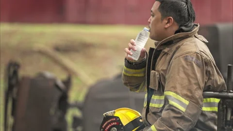A feeling regret of a firefighter, sit and rests Stock-Footage 326219425