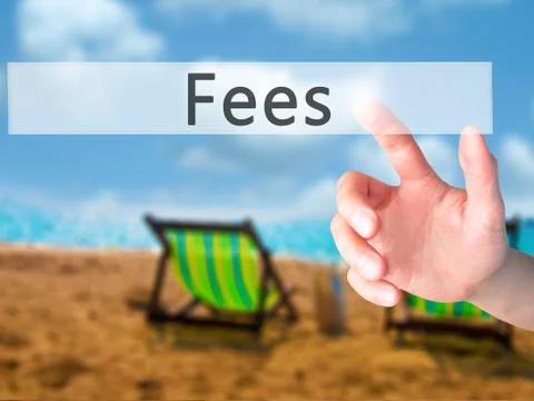 Fees - Hand pressing a button on blurred background concept on visual screen. Stock Photos