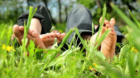 Feet and legs child, Babys feet in the g... | Stock Video | Pond5