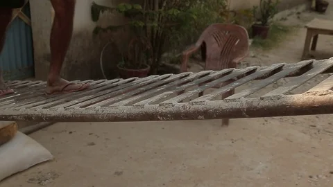 Feet and legs of poor laborer. Barefoot close up. India Stock Footage