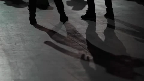 Feet and their shadows of dancing people at a concert. Stock Footage 318914032