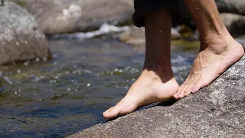Feet approaching stream 스톡 동영상 73489362