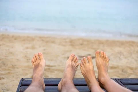 Feet are on the beach Stock Photos