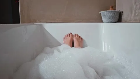Feet in a bubble bath Stock Footage 340933950