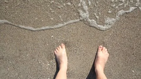 Feet caressed by the sea waves Stock Footage 12271586