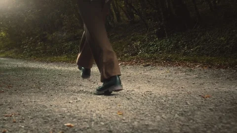 Feet of a child bouncing merrily along a path through the woods. Stock Footage 307596636