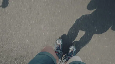 Feet of the child on rollers. The child learns to skate. Stock Footage 91377022