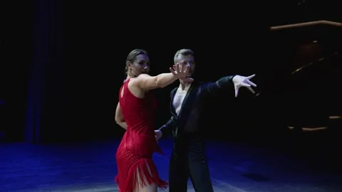 Feet closeup of Argentinian tango dancer in a red dress. Ballroom couple dancing Stock Footage 282021643