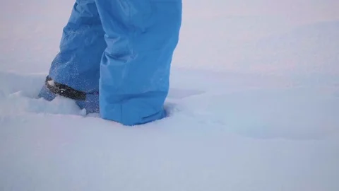 Feet closeup coming through deep snow. Walk in the fresh air Видео 84852514