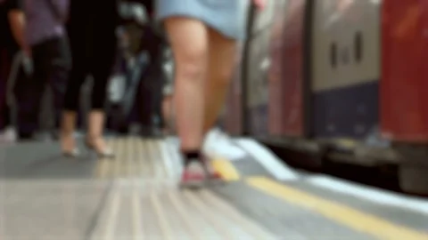 Feet of Commuters at Underground Station While Train is Arrivng in London Video stock 110779808