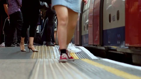 Feet of Commuters While Underground Train is Arrivng, People Entering Stock Footage 110622296