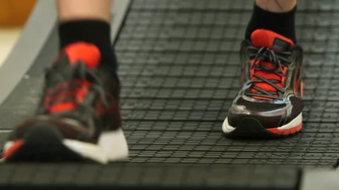 Feet on a curved running machine Stock Footage 103327675