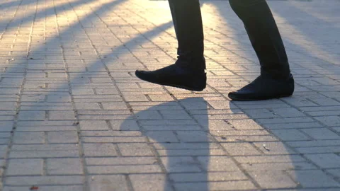 Feet of a dancing guy on the sidewalk Video stock 108380903