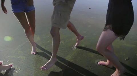 Feet dancing in water Stock Footage 52587807