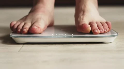 Feet on Digital Bathroom Scale Stock Footage 325036229