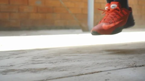 Feet doing jump rope Stock Footage 127635716