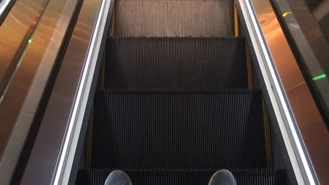 Feet down the moving escalator, high angle view. staircase steps, mall Stock Footage 164298989
