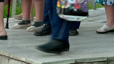 The feet of the elderly are on the road Stock Footage 79716389