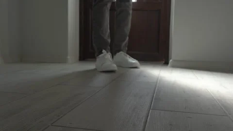 Feet enter the room Stock Footage 243208115