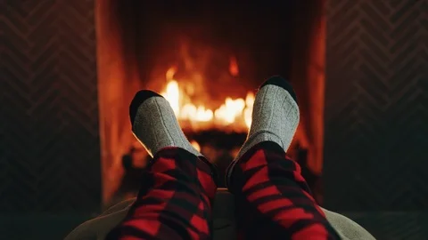 Feet Up by Fire relaxing Stock Footage 101451018