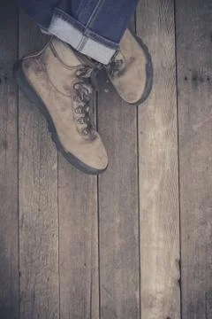Feet. First-Person view on rustic wood background. Stock Photos