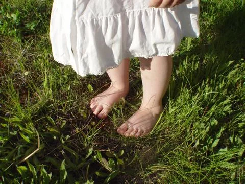 Feet in grass Foto stock