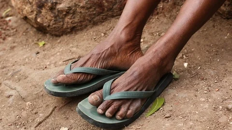 Feet in green flip flops Stock-Footage 100057784