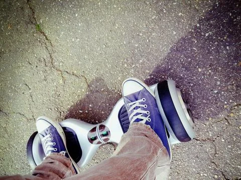 Feet on hoverboard Stock Photos