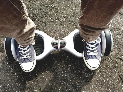 Feet on hoverboard Photos
