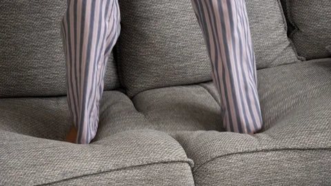 Feet jumping on sofa Video stock 104929254