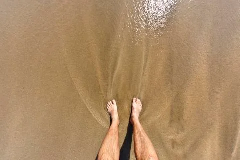 Feet of man at the beach Foto stock