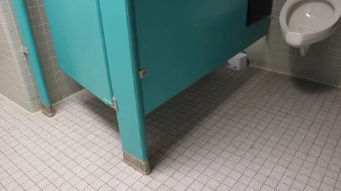 guy on toilet stall
