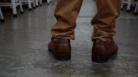 Feet of man in formal suit and leather shoes walking in corridor of the compu Stock Footage