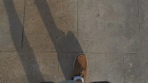 The feet of the man walking along the path Stock Footage 131880643