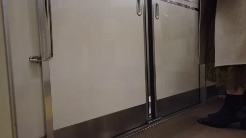 To the feet of passenger while getting out from the train-subway commuter Stock Footage 153477339