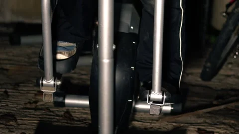 Feet pedal on exercise machine in garage basement 스톡 동영상 282802769
